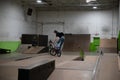 Bikers and skaters are practicing their tricks inside Royalty Free Stock Photo