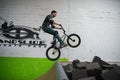 Bikers and skaters are practicing their tricks inside Royalty Free Stock Photo