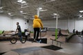 Bikers and skaters are practicing their tricks inside Royalty Free Stock Photo