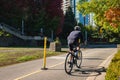 Bikes on Bicycle Path. Ride a bicycle. Cyclist on Bike lane on city Street. Back view of a man with helmet on bike ride