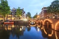 Bikes, boats, canal in Amsterdam, The Netherlands Royalty Free Stock Photo