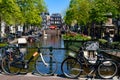 Bikes on the bridge that crosses the canal in Amsterdam Royalty Free Stock Photo