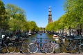 Bikes on the bridge that crosses the canal in Amsterdam Royalty Free Stock Photo