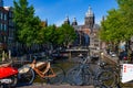 Bikes on the bridge that crosses the canal in Amsterdam Royalty Free Stock Photo