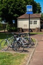 Bikes chained to a rack on the National Cycle route at a bus stop at Dumfries, Scotland