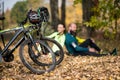 Bikes and couple of cyclists in park Royalty Free Stock Photo