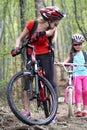 Bikes cycling family. Mother and daughter wearing helmet are cycling on bicycles . Royalty Free Stock Photo