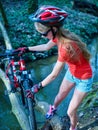 Bikes cycling girl cycling fording throught water .