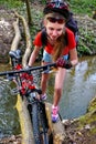Bikes cycling girl cycling fording throught water. Royalty Free Stock Photo
