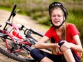 Bikes cycling girl wearing helmet. Girl girl fell off bike. Royalty Free Stock Photo