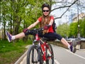 Bikes cycling girl wearing helmet with legs apart. Royalty Free Stock Photo