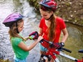 Bikes cycling girl wearing helmet look at compass. Royalty Free Stock Photo