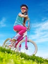 Bikes cycling girl wearing helmet rides bicycle. Royalty Free Stock Photo