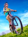 Bikes cycling girl wearing helmet rides bicycle. Royalty Free Stock Photo