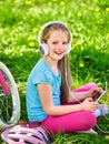 Bikes cycling girl wearing helmet watching at tablet pc . Royalty Free Stock Photo