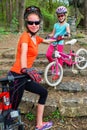 Bikes family. Mother and daughter wearing helmet cycling on bicycles . Royalty Free Stock Photo