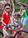 Bikes girl cycling fording throught water .