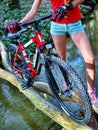 Bikes girl cycling fording throught water .