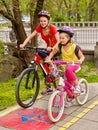 Bikes girls with rucksack cycling on bike lane. Royalty Free Stock Photo