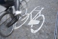 Bikes Lane Symbol and Cyclist, Amsterdam Royalty Free Stock Photo