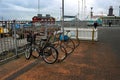 Bikes neaty lined up in a shopping district in the city. Reykjavik is a very walking or cycling friendly city..