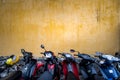 Bikes parked near building with grungy wall. Royalty Free Stock Photo