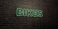 BIKES -Realistic Neon Sign on Brick Wall background - 3D rendered royalty free stock image Royalty Free Stock Photo