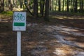 Bikeway in the forest. Wooden road sign