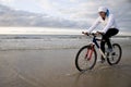 Biking on the beach Royalty Free Stock Photo