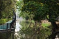 Biking lane along clean canal and green park