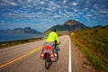 Biking in Norway against picturesque landscape. Bike, active