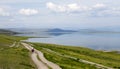 Biking on a Two-track alongside a large lake Royalty Free Stock Photo