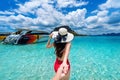 Bikini girl holding man`s hand and leading him to ocean in Krabi, Thailand Royalty Free Stock Photo