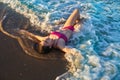 Bikini girl relaxed lying on the beach sand Royalty Free Stock Photo