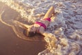 Bikini girl relaxed lying on the beach sand Royalty Free Stock Photo