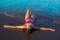 Bikini girl relaxed lying on the beach sand Royalty Free Stock Photo