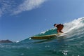 A bikini longboard surfer