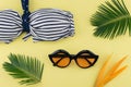 Bikini, and sunglasses on yellow background