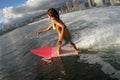 Bikini surfer girl surfing