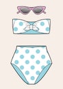 Bikini swimsuit for summer with polka dot pattern and cateyes sunglasses Royalty Free Stock Photo