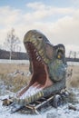 Bila Tserkva Ukraine January 2020: Abandoned huge head of decorative dinosaur on winter lawn