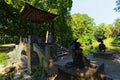 Wide angle view of famous Chinese Bridge with Sculptures of Chinese wise man and young woman with umbrella Royalty Free Stock Photo