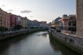 Nervion river at Ribera market and San Anton church at sunset