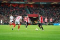 BILBAO, SPAIN - ARPIL 7: Mikel Balenziaga, Iker Muniain, and Vitolo in the match between Athletic Bilbao and Sevilla in the UEFA