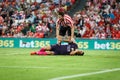 BILBAO, SPAIN - AUGUST 28: Luis Suarez, FC Barcelona player, on the grass, injured with Aymeric Laporte, Bilbao player, in the mat Royalty Free Stock Photo