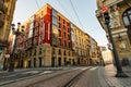 BILBAO, SPAIN-DECEMBER 19, 2021 : Old building and empty tramway track for city tram. Citysacpe of Bilbao, Spain. Smart city. Red Royalty Free Stock Photo