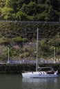 BILBAO, SPAIN-MAY, 5TH, 2022: Veritcal view of boat sailing along the Nervion River in the Zorrozaurre neighborhood Royalty Free Stock Photo