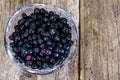 Bilberry in Crystal Bowl on Rustic Background