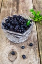 Bilberry in Crystal Bowl on Rustic Background