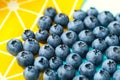 Bilberry on a yellow background, macro image of blueberries on a yellow kitchen textiles Royalty Free Stock Photo